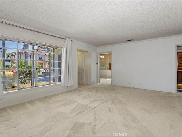 10348 Woodbridge St, Toluca Lake, CA 91602 - carpeted spare room featuring a textured ceiling, plenty of natural light, and crown molding