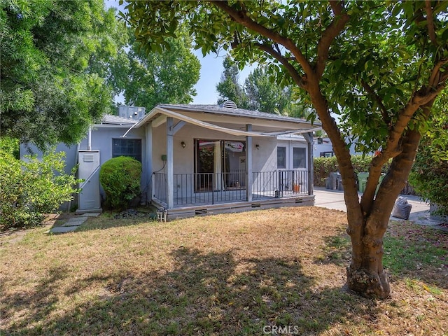 10348 Woodbridge St, Toluca Lake, CA 91602 - bungalow with covered porch, a front lawn, and stucco siding