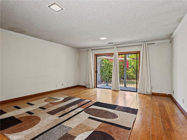 10348 Woodbridge St, Toluca Lake, CA 91602 - unfurnished room featuring hardwood / wood-style flooring, a textured ceiling, and crown molding