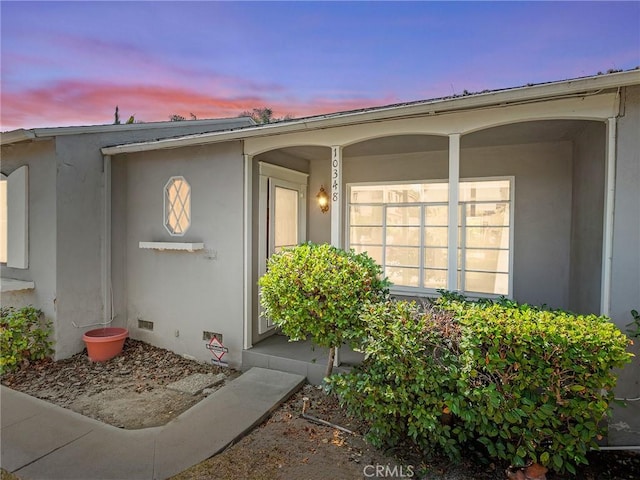 10348 Woodbridge St, Toluca Lake, CA 91602 - exterior entry at dusk with a porch