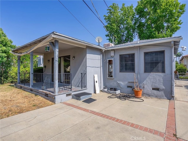 10348 Woodbridge St, Toluca Lake, CA 91602 - back of property with a porch and stucco siding