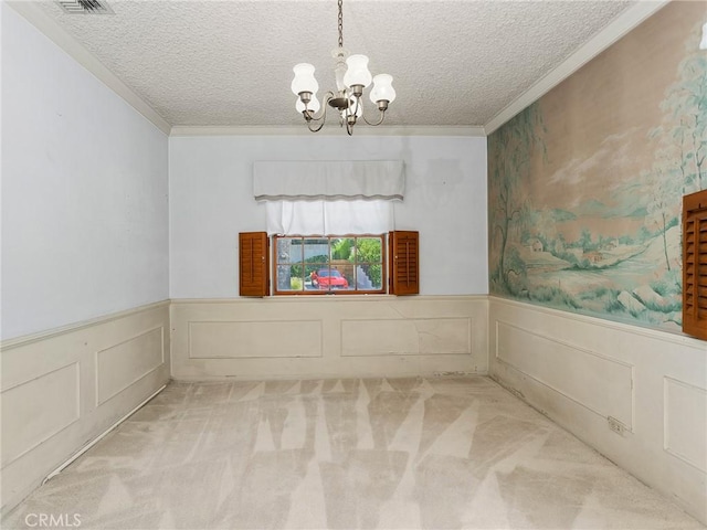 10348 Woodbridge St, Toluca Lake, CA 91602 - carpeted empty room featuring a chandelier, a textured ceiling, crown molding, and wainscoting