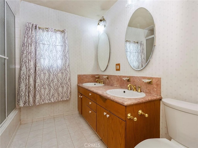 10348 Woodbridge St, Toluca Lake, CA 91602 - bathroom featuring wallpapered walls, double vanity, a shower with shower curtain, and tile patterned floors