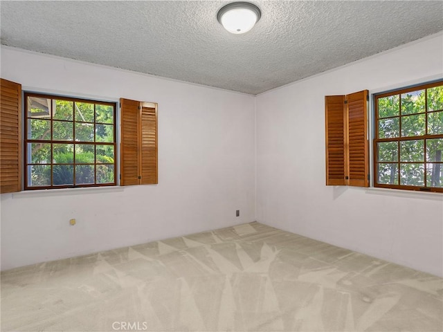 10348 Woodbridge St, Toluca Lake, CA 91602 - carpeted spare room featuring a textured ceiling
