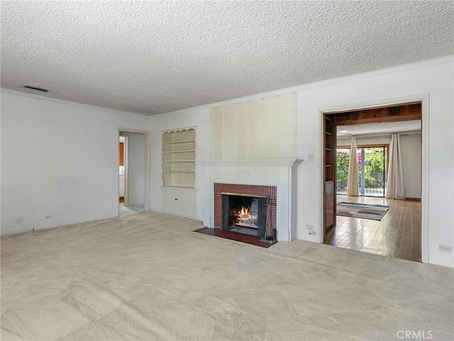 10348 Woodbridge St, Toluca Lake, CA 91602 - unfurnished living room with a textured ceiling, crown molding, carpet, and a brick fireplace