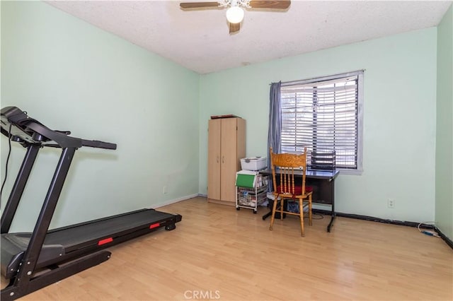 16533 Nordhoff St, North Hills, CA 91343 - workout area with wood finished floors, a ceiling fan, and a textured ceiling