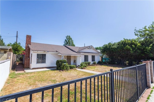 16533 Nordhoff St, North Hills, CA 91343 - ranch-style home with a chimney, stucco siding, a fenced backyard, and a shingled roof