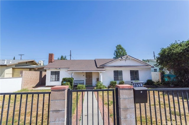 16533 Nordhoff St, North Hills, CA 91343 - bungalow with stucco siding, a fenced front yard, a chimney, a gate, and roof with shingles