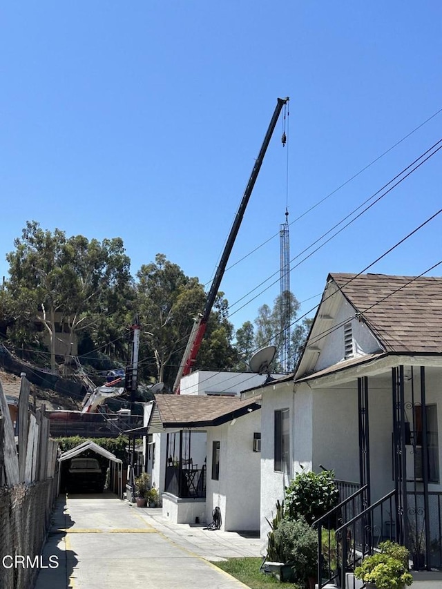 2744 Lanfranco St, Los Angeles, CA 90033 - view of property exterior featuring stucco siding and driveway