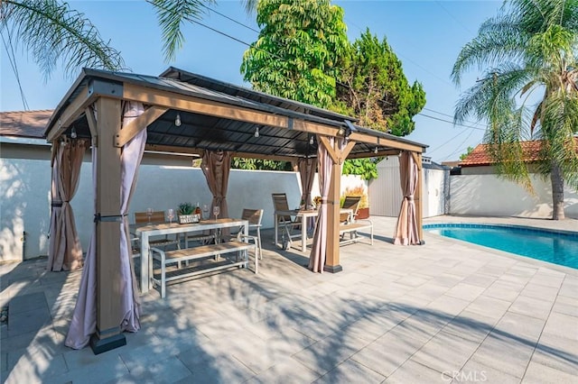6204 Oak Ave, Temple City, CA 91780 - view of pool with a gazebo, outdoor dining area, a fenced backyard, a storage unit, and a patio area