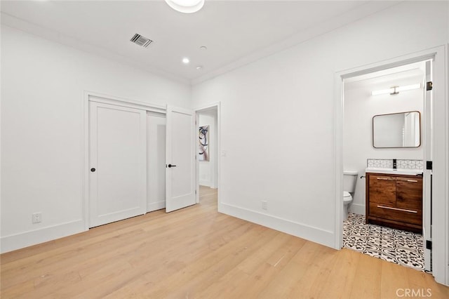 6204 Oak Ave, Temple City, CA 91780 - unfurnished bedroom with light wood-type flooring, connected bathroom, a closet, and recessed lighting