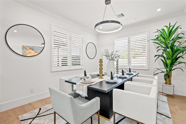 6204 Oak Ave, Temple City, CA 91780 - dining room with light wood finished floors and ornamental molding