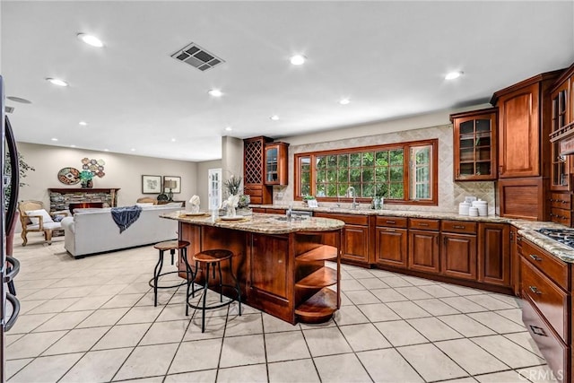 1310 Santa Margarita Dr, Arcadia, CA 91006 - kitchen with open floor plan, light tile patterned floors, backsplash, light stone countertops, and recessed lighting