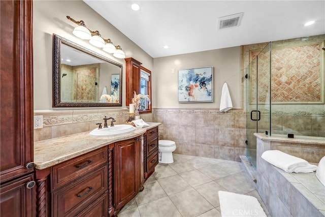 1310 Santa Margarita Dr, Arcadia, CA 91006 - bathroom with tile walls, vanity, tile patterned floors, a stall shower, and wainscoting