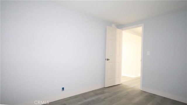 460 E 2nd St, San Jacinto, CA 92583 - empty room with wood finished floors and baseboards