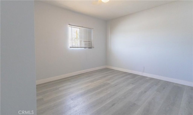 460 E 2nd St, San Jacinto, CA 92583 - empty room with wood finished floors and baseboards