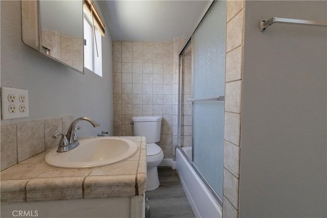 460 E 2nd St, San Jacinto, CA 92583 - full bath with tile walls, vanity, combined bath / shower with glass door, and wood finished floors