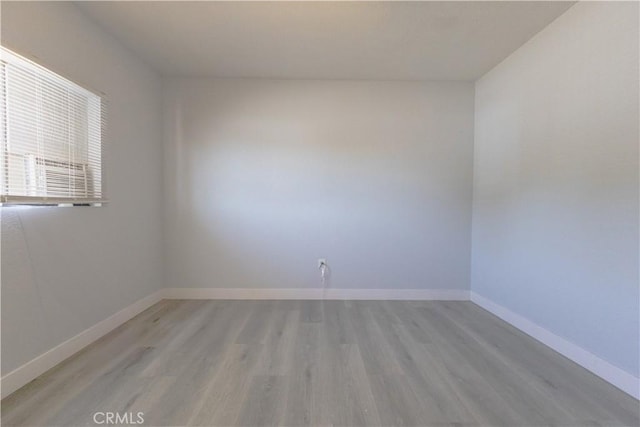 460 E 2nd St, San Jacinto, CA 92583 - spare room featuring light wood finished floors and baseboards