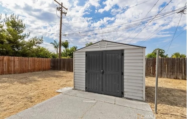 460 E 2nd St, San Jacinto, CA 92583 - view of shed with a fenced backyard