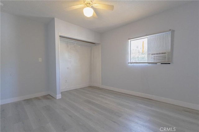 460 E 2nd St, San Jacinto, CA 92583 - unfurnished bedroom with wood finished floors, a closet, and a ceiling fan