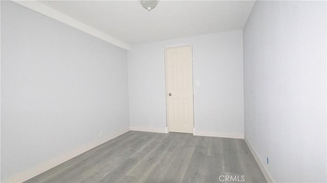 460 E 2nd St, San Jacinto, CA 92583 - empty room with wood finished floors and baseboards