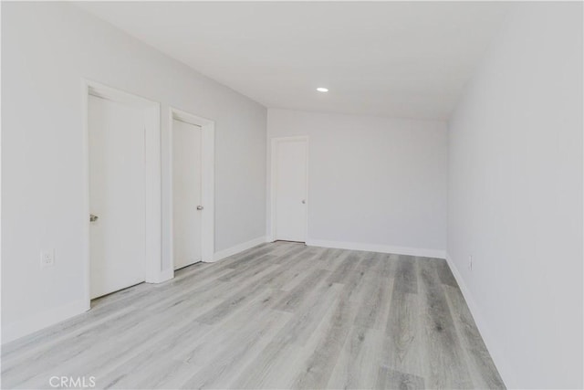 460 E 2nd St, San Jacinto, CA 92583 - empty room with light wood finished floors and recessed lighting