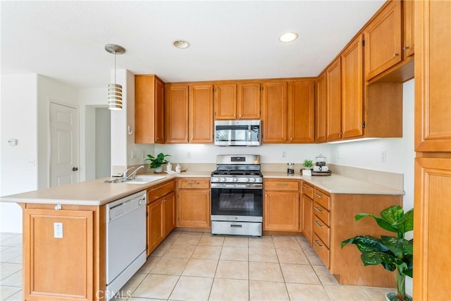 391 Franciscan Way, Oceanside, CA 92057 - kitchen with stainless steel appliances, a peninsula, light tile patterned flooring, light countertops, and recessed lighting