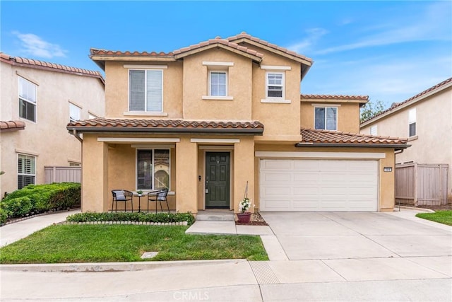 391 Franciscan Way, Oceanside, CA 92057 - mediterranean / spanish-style house with a porch, stucco siding, driveway, a tiled roof, and an attached garage