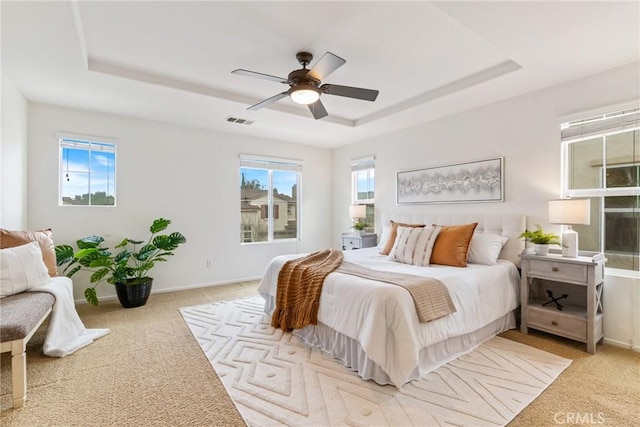 391 Franciscan Way, Oceanside, CA 92057 - bedroom with a raised ceiling, light carpet, and a ceiling fan