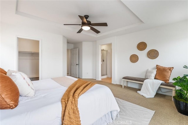 391 Franciscan Way, Oceanside, CA 92057 - bedroom featuring a raised ceiling, carpet flooring, ceiling fan, a walk in closet, and ensuite bath