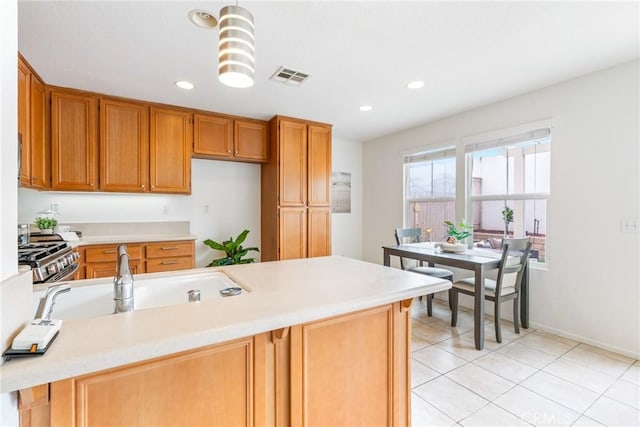 391 Franciscan Way, Oceanside, CA 92057 - kitchen featuring light countertops, stainless steel range with gas cooktop, recessed lighting, and light tile patterned floors