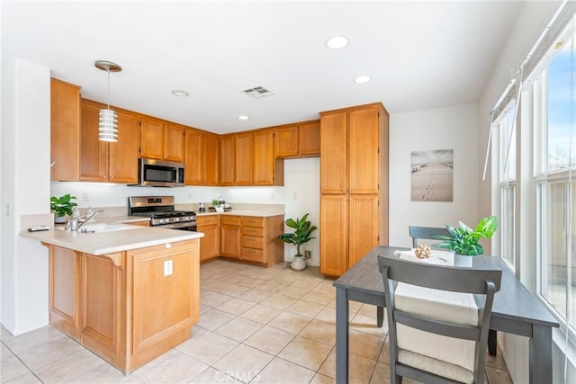 391 Franciscan Way, Oceanside, CA 92057 - kitchen featuring a peninsula, stainless steel appliances, light countertops, light tile patterned floors, and recessed lighting