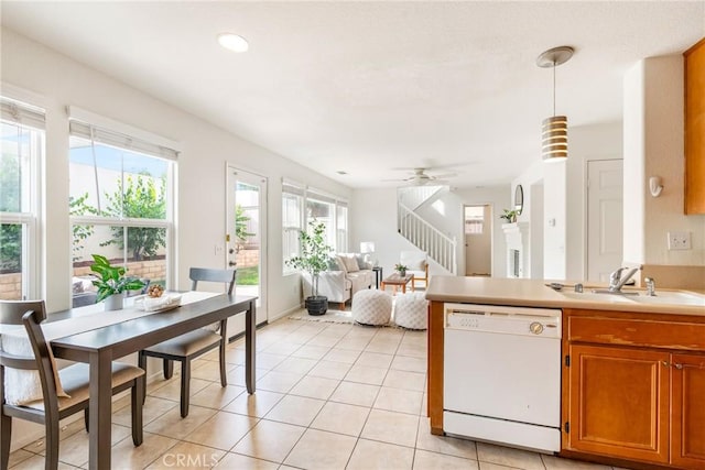 391 Franciscan Way, Oceanside, CA 92057 - kitchen featuring white dishwasher, brown cabinets, light tile patterned floors, pendant lighting, and light countertops