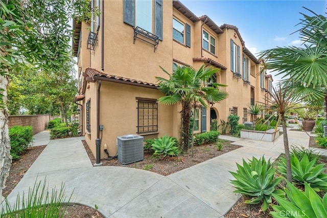 20950 Cornerstone Dr, Walnut, CA 91789 - view of front of home featuring stucco siding and a tile roof