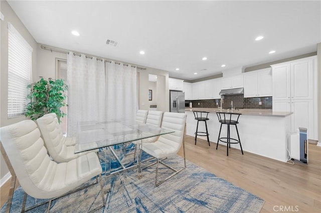 20950 Cornerstone Dr, Walnut, CA 91789 - dining space with light wood-type flooring and recessed lighting