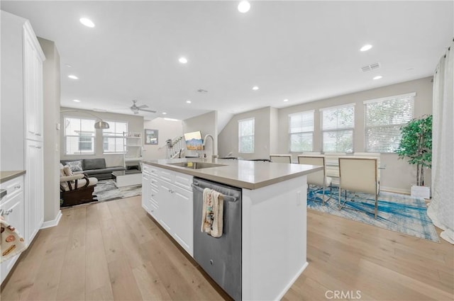 20950 Cornerstone Dr, Walnut, CA 91789 - kitchen with light wood-style flooring, white cabinetry, stainless steel dishwasher, open floor plan, and recessed lighting