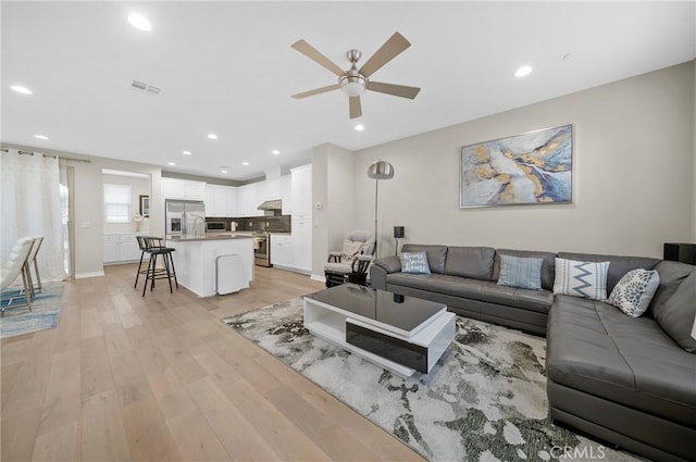 20950 Cornerstone Dr, Walnut, CA 91789 - living area with a ceiling fan, light wood finished floors, and recessed lighting