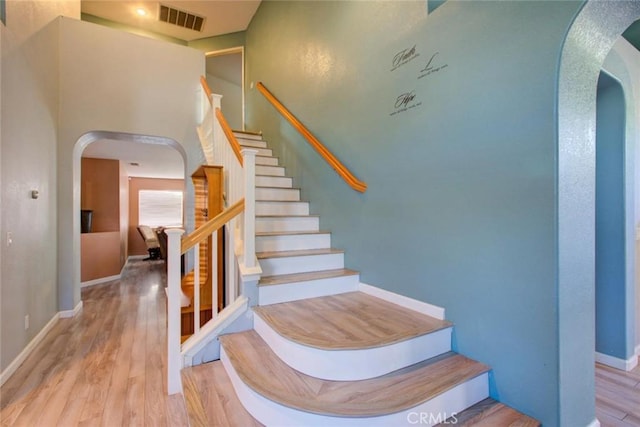 1166 Labrador Ct, Newman, CA 95360 - stairway featuring arched walkways and wood finished floors