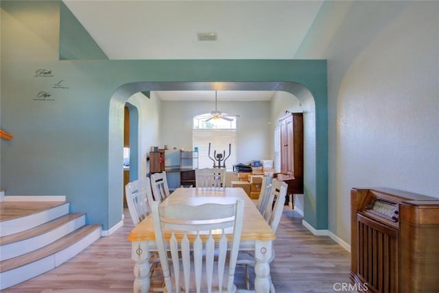 1166 Labrador Ct, Newman, CA 95360 - dining room with arched walkways, light wood-type flooring, and ceiling fan