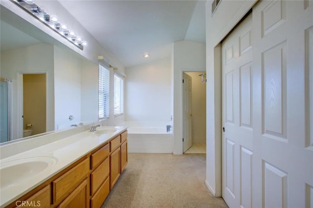 1166 Labrador Ct, Newman, CA 95360 - full bathroom with a garden tub, double vanity, and recessed lighting