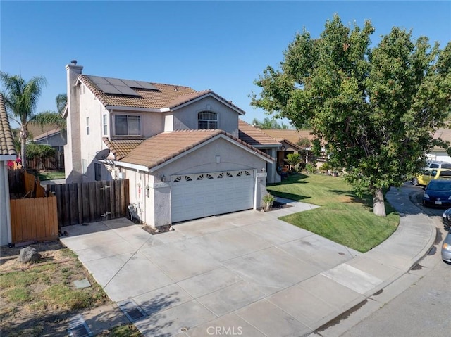 1166 Labrador Ct, Newman, CA 95360 - view of front of property featuring solar panels, a garage, stucco siding, a tiled roof, and concrete driveway