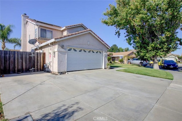 1166 Labrador Ct, Newman, CA 95360 - mediterranean / spanish house with a chimney, stucco siding, concrete driveway, a garage, and a tile roof