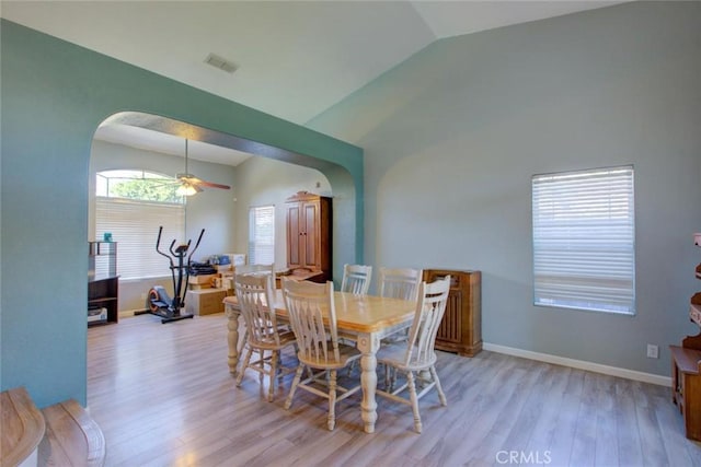 1166 Labrador Ct, Newman, CA 95360 - dining room featuring lofted ceiling, arched walkways, light wood finished floors, and ceiling fan
