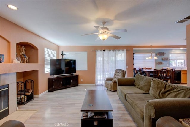 1166 Labrador Ct, Newman, CA 95360 - living area featuring a fireplace, light wood-type flooring, ceiling fan, and recessed lighting