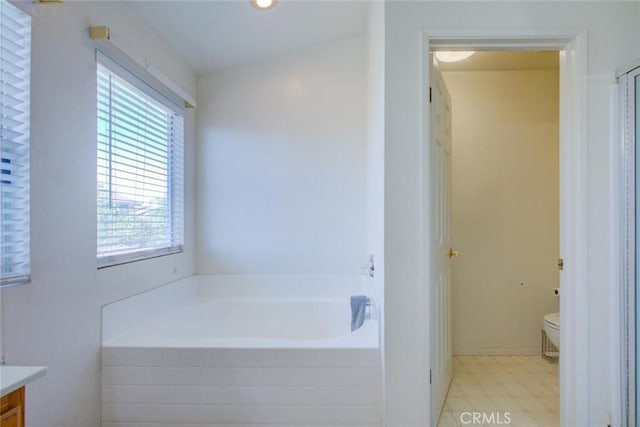 1166 Labrador Ct, Newman, CA 95360 - bathroom with a garden tub, vanity, and tile patterned floors