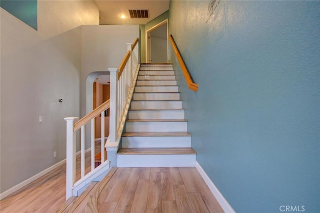 1166 Labrador Ct, Newman, CA 95360 - stairs with wood finished floors and arched walkways