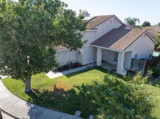 1166 Labrador Ct, Newman, CA 95360 - view of front facade featuring stucco siding, solar panels, and a tiled roof