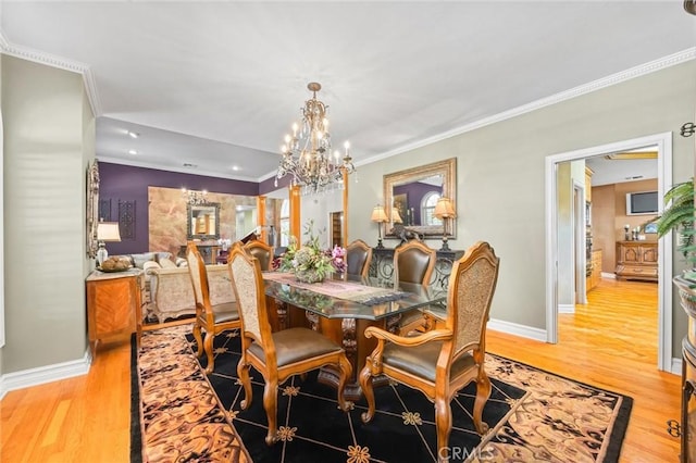 8905 Saint Cloud Ln, Bakersfield, CA 93311 - dining space with a chandelier, light wood finished floors, ornamental molding, and recessed lighting