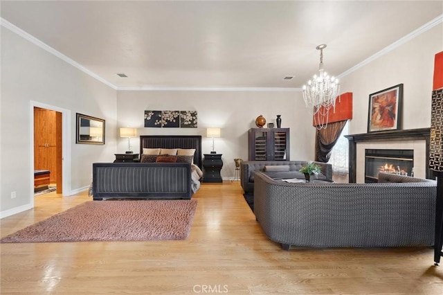 8905 Saint Cloud Ln, Bakersfield, CA 93311 - living area featuring a chandelier, wood finished floors, a glass covered fireplace, and crown molding