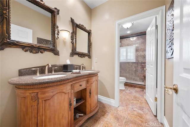8905 Saint Cloud Ln, Bakersfield, CA 93311 - full bathroom featuring a stall shower, double vanity, and stone tile flooring